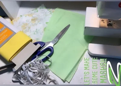 scissors and material beside a sewing machine